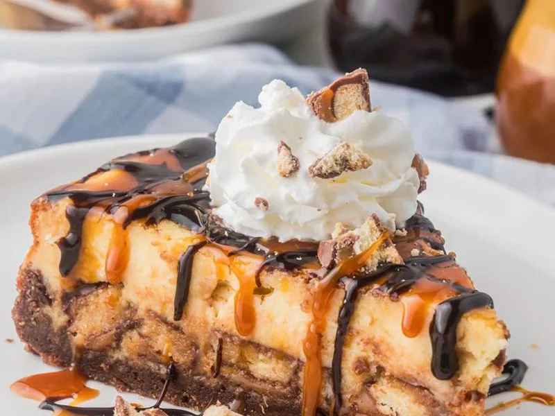 Twix Candy Bar Cheesecake with Caramel Drizzle