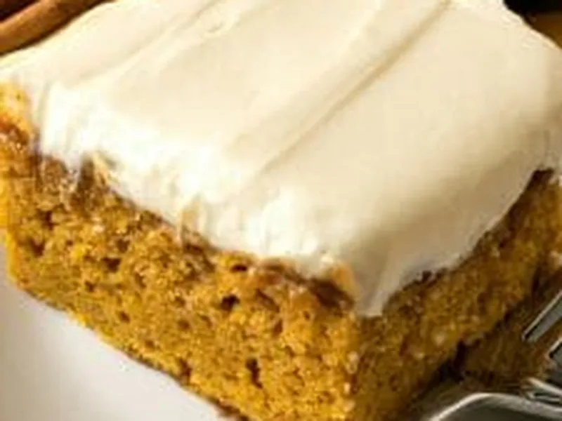 Pumpkin Cider Poke Cake with Cream Cheese Frosting
