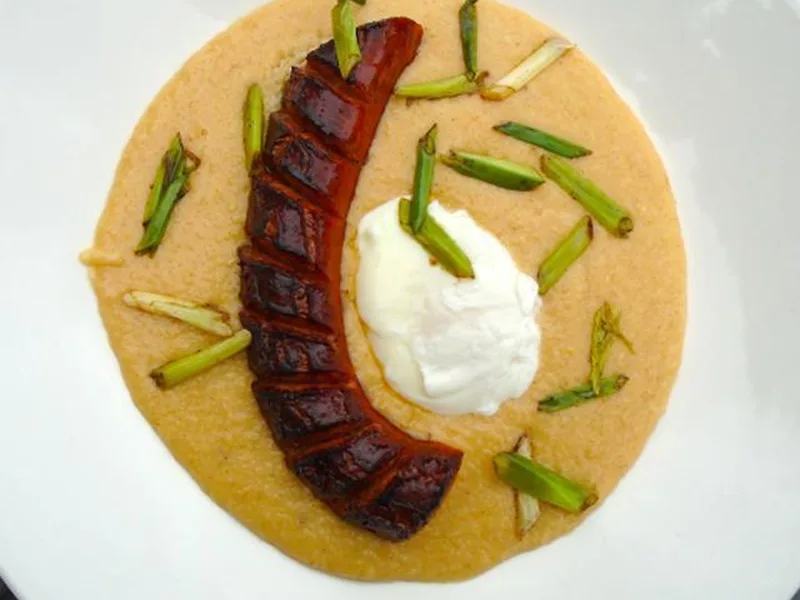 Creamy Polenta Bowl with Spicy Sausage and Poached Egg