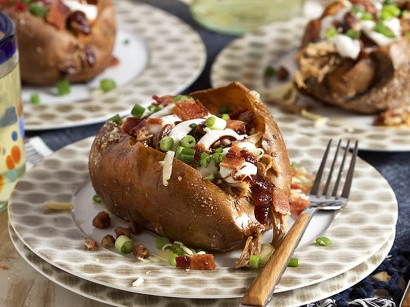 Loaded Pulled Pork Stuffed Sweet Potatoes with Bacon and Cheese