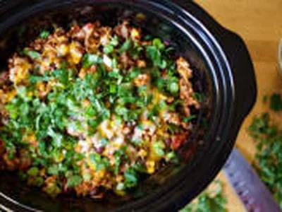 Slow Cooker Cheesy Chicken and Farro Enchilada Bowl