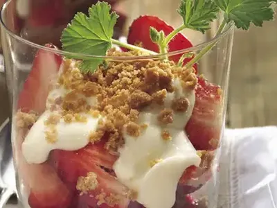Strawberry Cheesecake Parfait with Orange Cream and Cookie Crumbs
