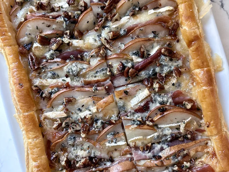 Brie Pear Prosciutto Puff Pastry with Herbed Nuts
