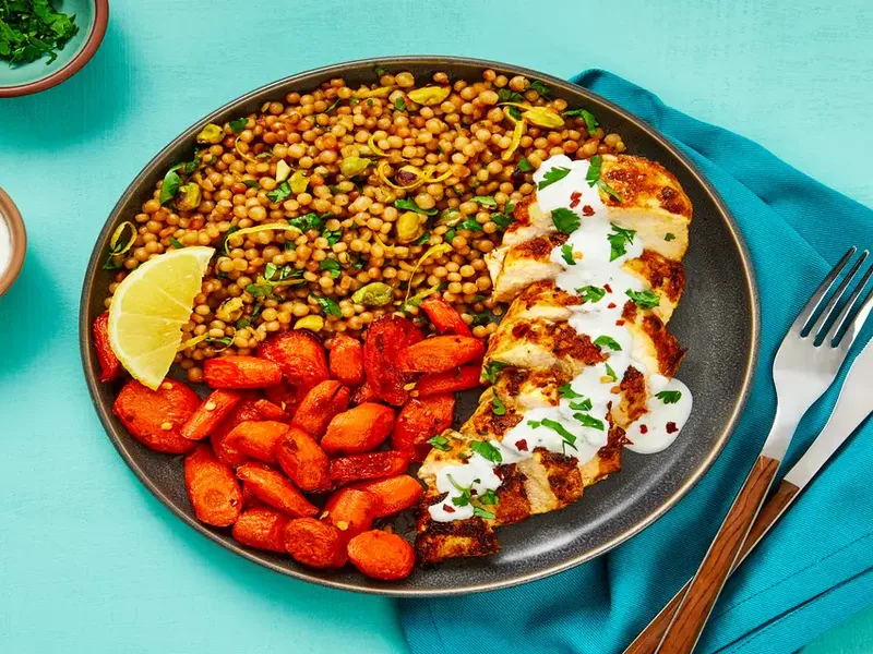 Yogurt-Marinated Chicken with Garlic Sauce & Pistachio Couscous