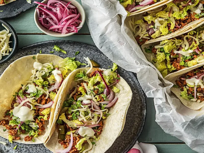 One-Pan Pork Carnitas Tacos with Lime Crema and Pickled Onions