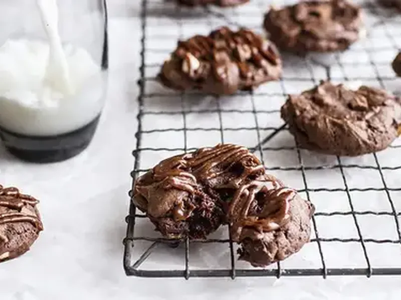Triple Chocolate Cheesecake Cookies with Cream Cheese Drizzle