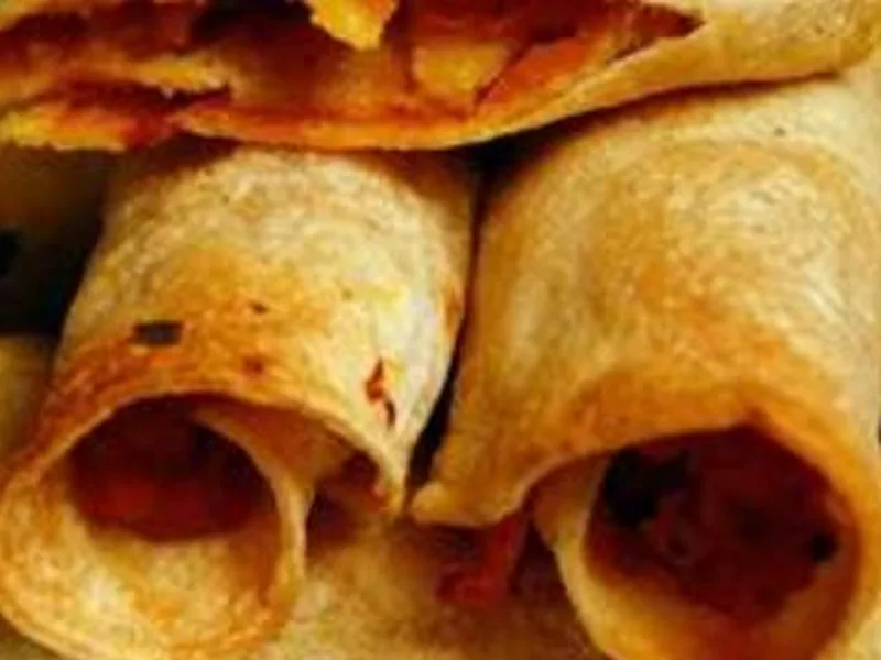 Sweet Potato Caramelized Onion Taquitos with Mole Sauce