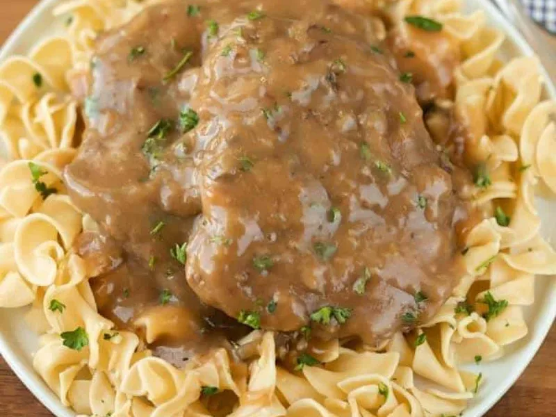 Slow Cooker Cube Steak and Mushroom Gravy Over Egg Noodles