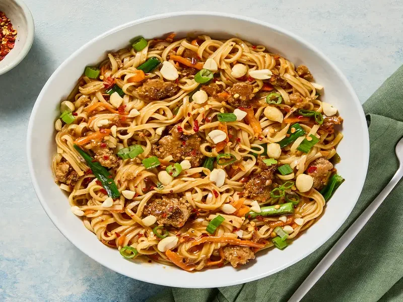 Szechuan Pork Noodle Stir-Fry with Carrot and Peanuts