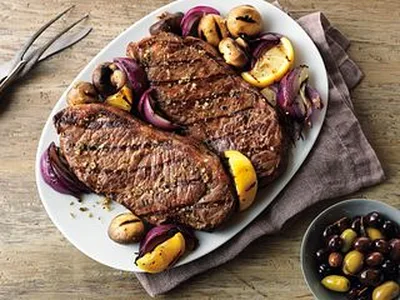 Grecian Beef Strip Steaks with Grilled Mushroom Kabobs
