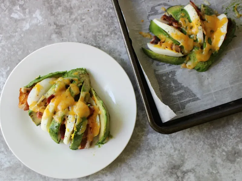 Keto Bacon Egg and Cheese Stuffed Avocados