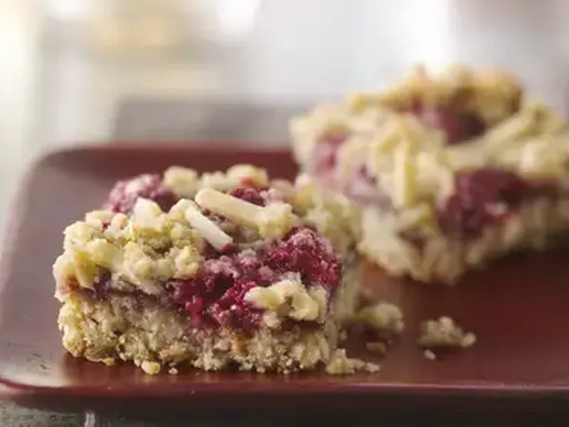 Chewy Raspberry Almond Oat Bars with Fresh Berries