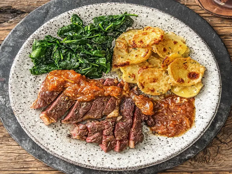 Pan-Seared Rib-Eye Steak with Truffled Potato Gratin