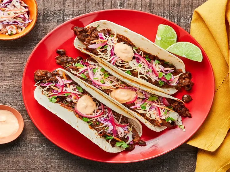 Smashed Black Bean Tacos with Creamy Slaw and Pickled Onion