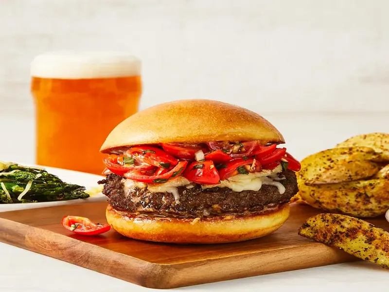 Bruschetta-Topped Beef Burgers with Roasted Potato Wedges