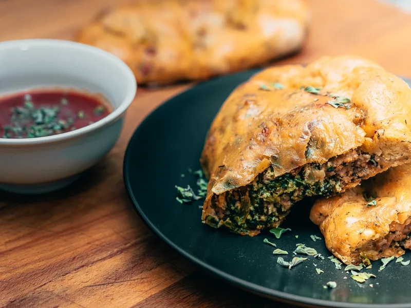 Baked Italian Sausage and Spinach Calzones with Ricotta