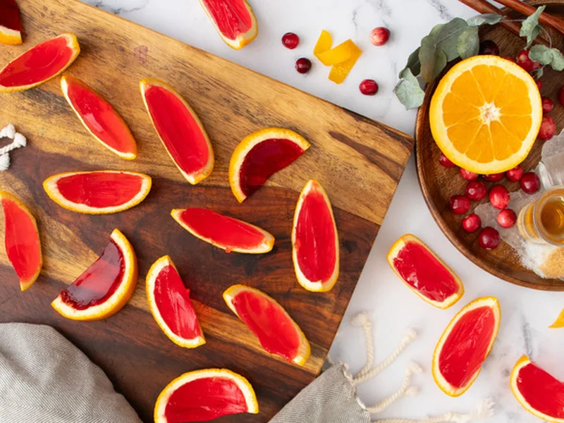 Cranberry Sidecar Jell-O Shots in Orange Peel Cups