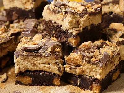 Fully Loaded Brownies with Butterfinger Peanut Frosting