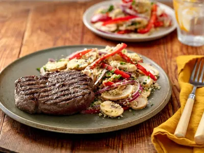 Seared Beef Steaks with Warm Couscous and Vegetable Salad