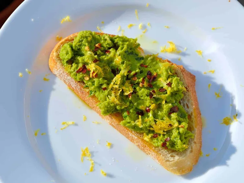 Lemony Pea Mash Crostini with Garlic and Fresh Herbs
