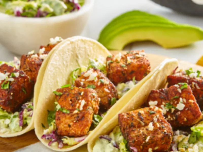 Pan-Seared Salmon Tacos with Creamy Avocado Brussels Slaw