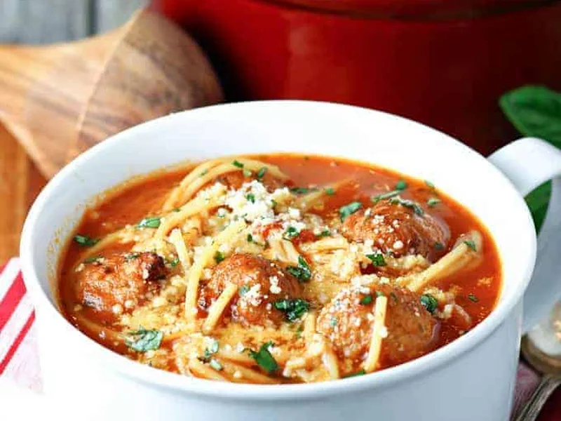 Hearty Spaghetti and Meatball Soup with Parmesan and Fresh Basil