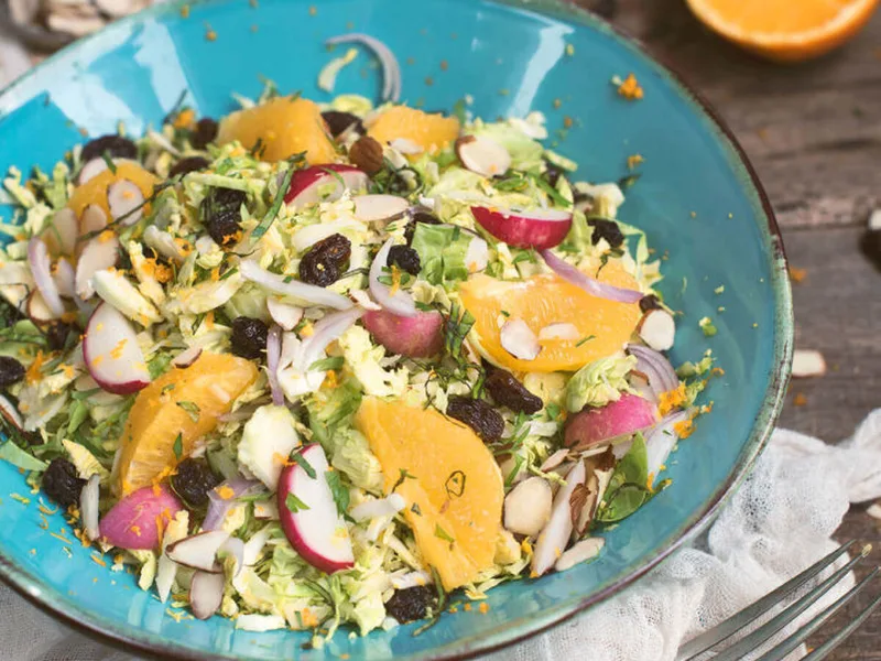 Brussels Sprout Salad with Raisins and Citrus Dressing
