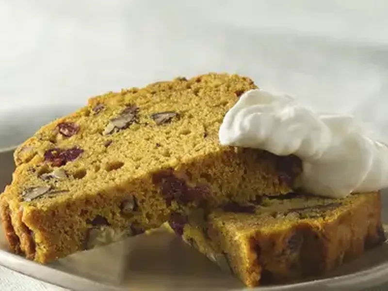 Pumpkin Cranberry Pecan Bread with Grand Marnier Whipped Cream