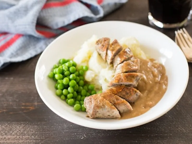 Sweet Potato Colcannon with Sausage and Onion Gravy