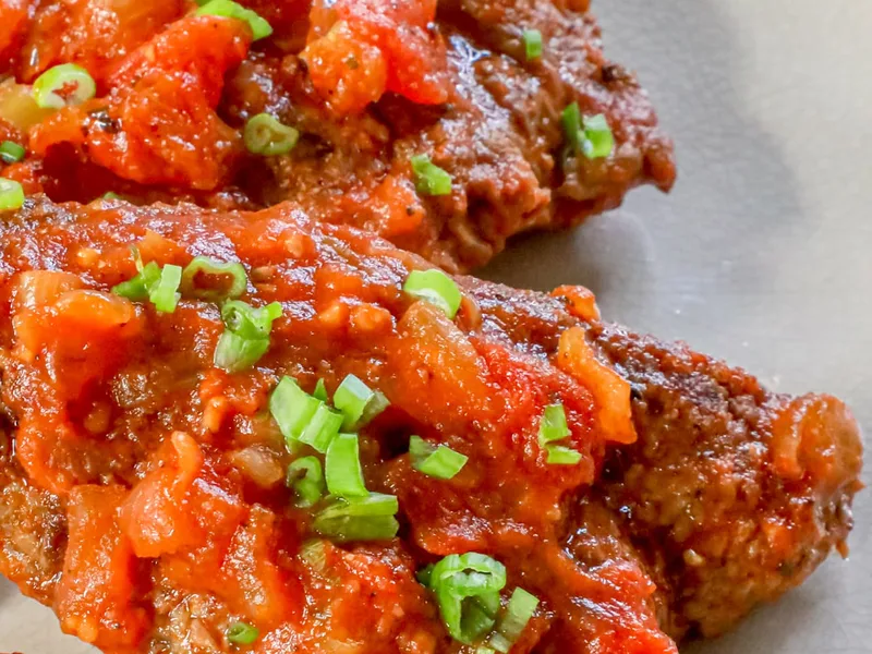 Braised Swiss Steaks with Tomato and Herb Sauce