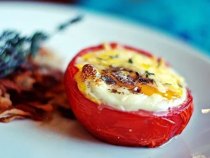 Three-Cheese Baked Eggs in Tomato Cups with Cheddar and Gruyere