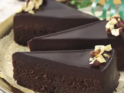Chocolate-Glazed Fudge Cake with Toasted Hazelnuts