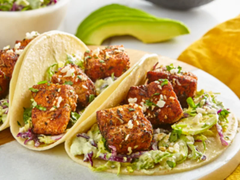 Creamy Avocado Salmon Tacos with Spiced Brussels Sprouts Slaw