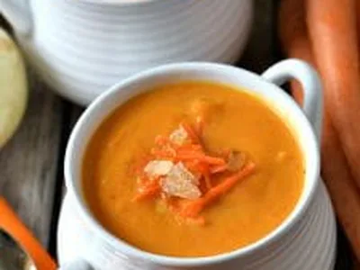 Creamy Carrot Ginger Soup with Honey and Fresh Herbs
