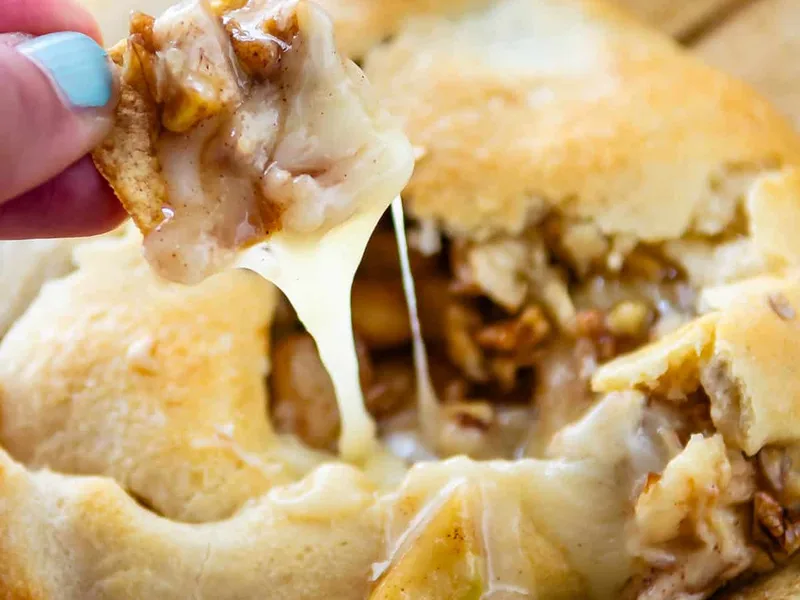 Baked Brie in Crescent Rolls with Spiced Apples and Pecans