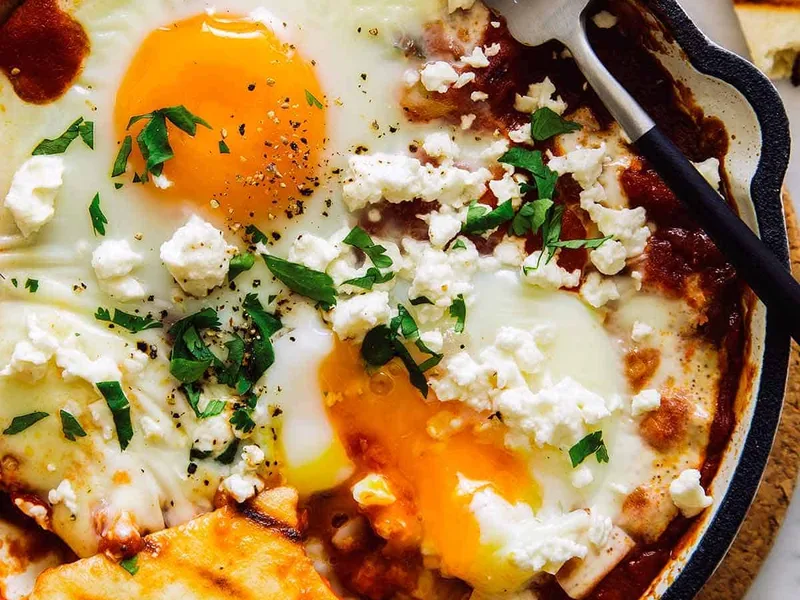 Individual Shakshuka with Hominy and Feta in Spiced Tomato Sauce