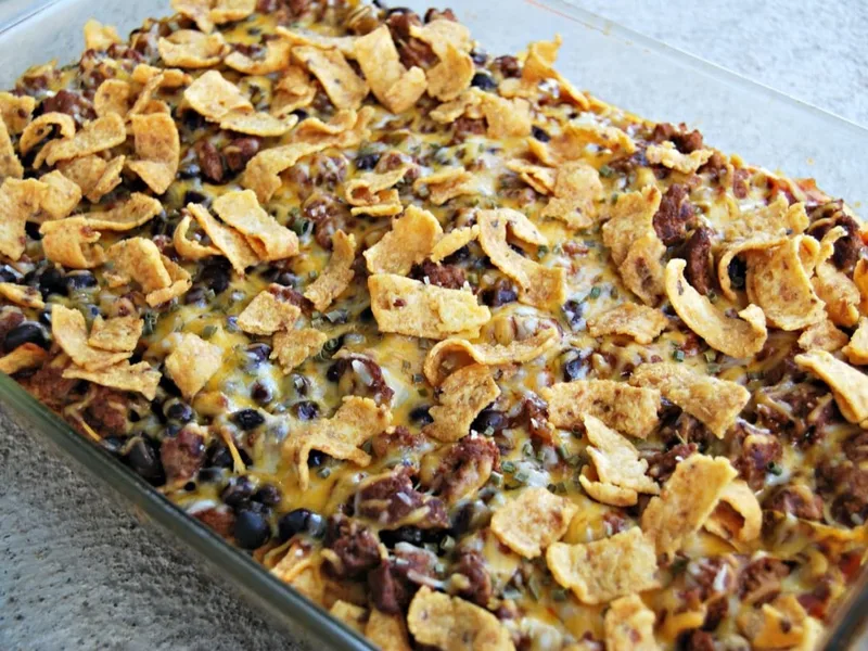 Layered Frito Pie Casserole with Ground Beef and Cheese
