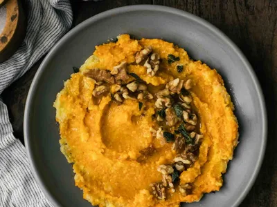 Creamy Roasted Carrot Polenta with Crispy Sage and Walnuts