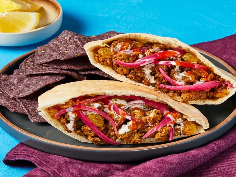 Shawarma-Spiced Beef and Golden Raisin Pitas with Quick Pickles