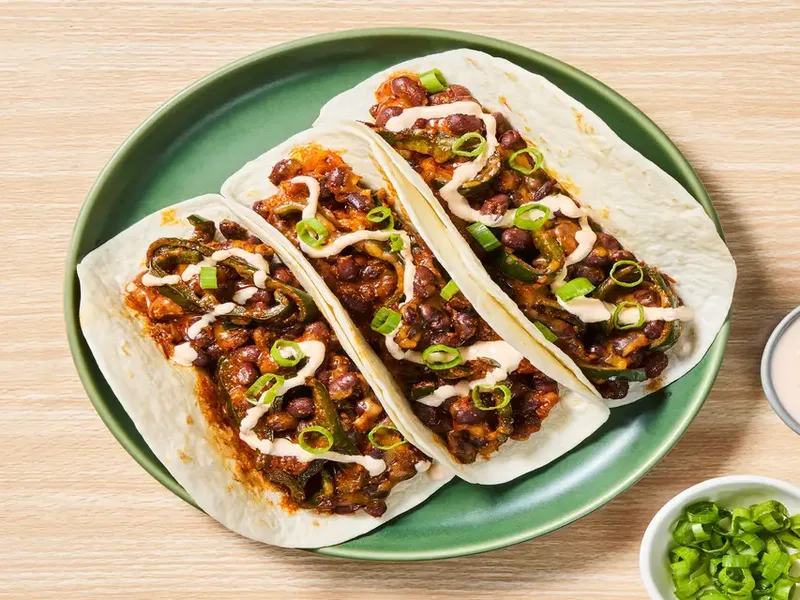One-Pan Cheesy Black Bean Tacos with Smoky Red Pepper Crema