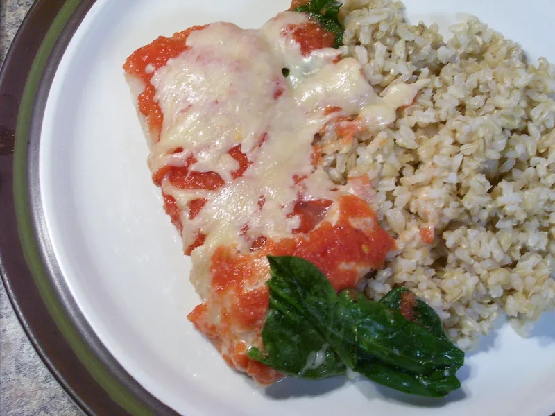 Baked Fish with Spinach, Tomatoes and Cheese