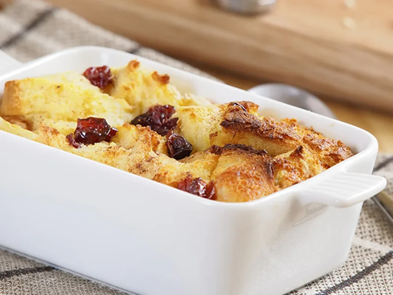 Artisan Cranberry Walnut Bread Pudding with Spiced Crème Fraîche