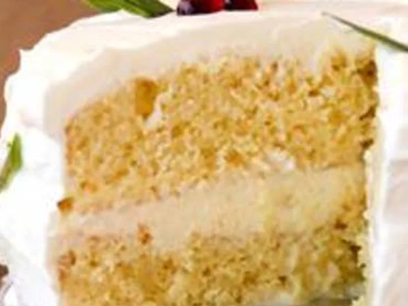 Eggnog Tres Leches Cake with Whipped Cream and Holly Garnish