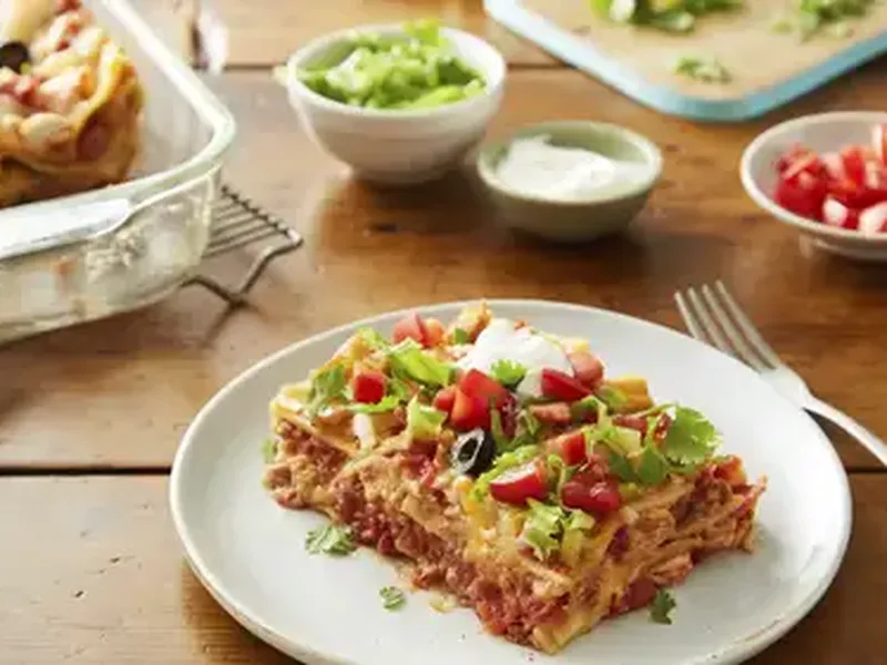 Overnight Taco Chicken Lasagna with Refried Bean Layers