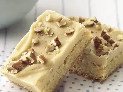 Blonde Brownies with Brown Sugar Frosting and Pecans