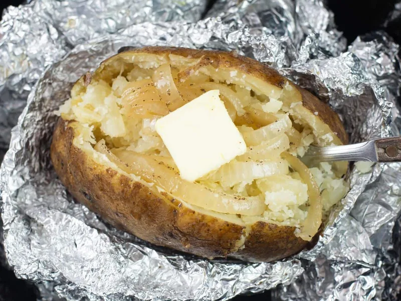 Slow Cooker Foil-Wrapped Baked Potatoes with Onion and Butter