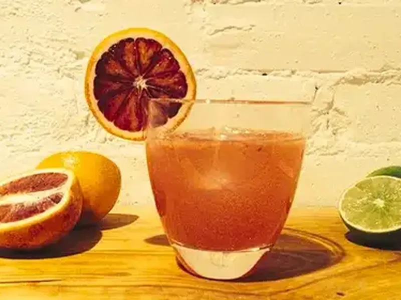 Blood Orange Gin and Ginger Beer Cocktail with Fresh Lime