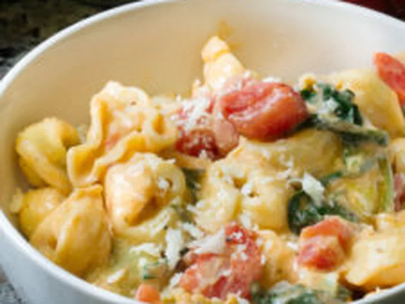 Creamy Grana Padano Tortellini with Tomatoes and Spinach