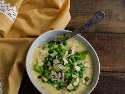 Creamy Polenta with Fresh Peas, Fennel, and Almonds