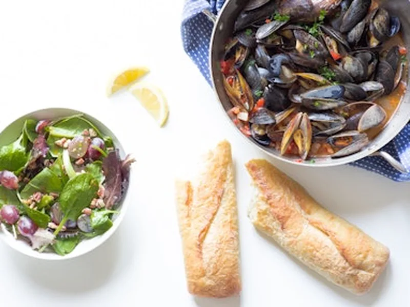 Mussels in Garlic White Wine Sauce with Pancetta and Peppers